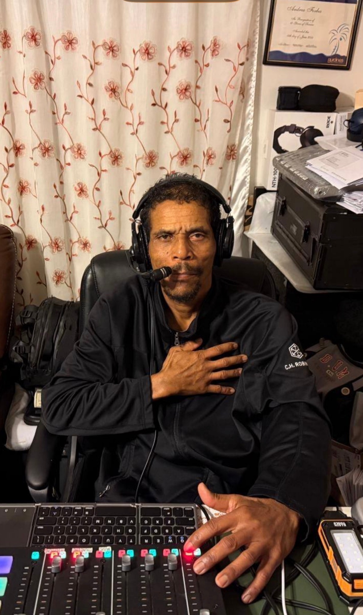 Richard Culture Gad Jones wearing headphones in the Reggae Nostalgia studio